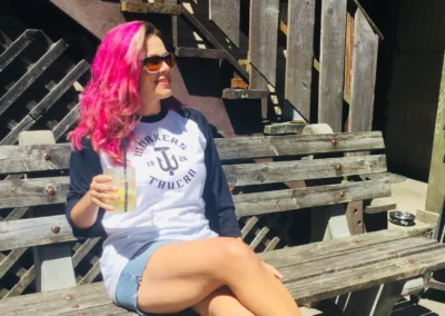 woman sitting at workers tavern enjoying a cocktail