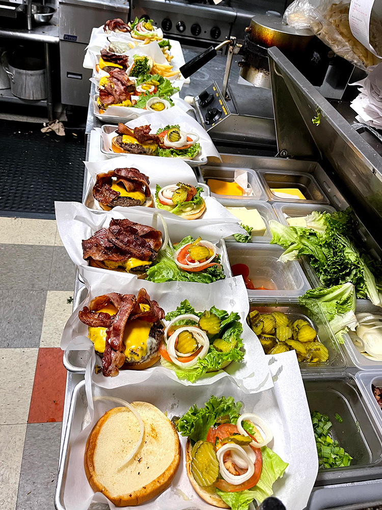 image of burgers being prepared at workers tavern